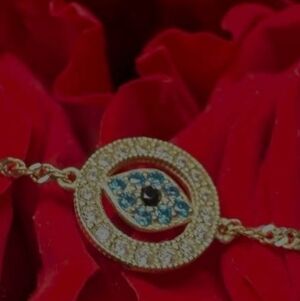 10 Kt Gold Evil Eye Bracelet With Topaz, Diamonds And Obsidian. 8.5 Inch Length.